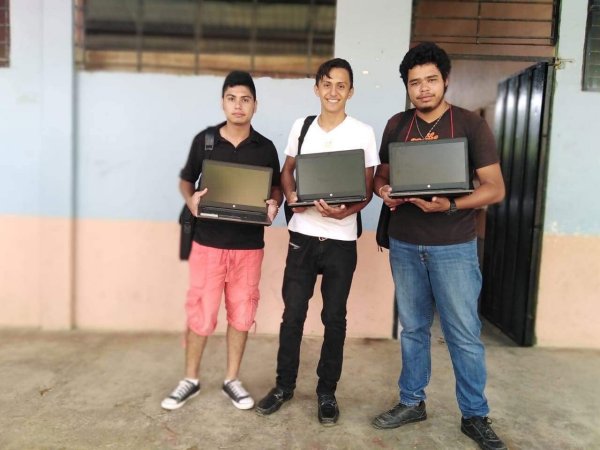 Youths taking part in the AHMEN program receiving the refurbished laptops sponsored by Peak Youths taking part in the AHMEN program receiving the refurbished laptops sponsored by Peak